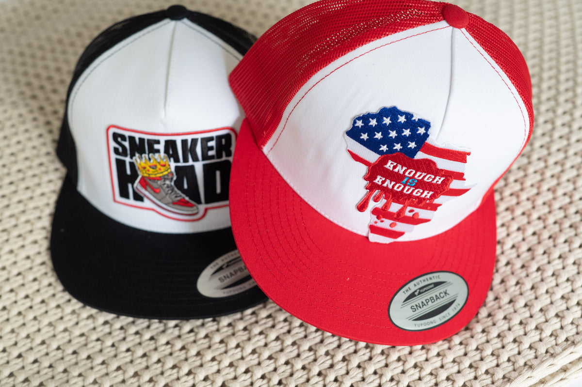 Gullah Geechee Origins trucker hats in black and white and charcoal and red