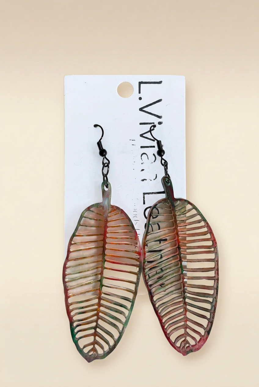 Banana leaf earrings on warm ivory background